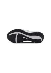 Suela de zapatilla en blanco y negro con goma texturizada para agarre, con un diseño curvado y un prominente logo de swoosh en blanco.
