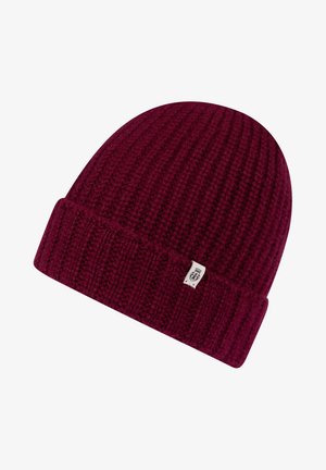 Knitted beanie in dark burgundy, featuring a ribbed texture and a folded cuff. Small logo patch sewn on the side.