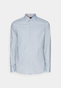 Ljusblå skjorta med knappar och lång ärm, mjukt tyg och rundad nederkant. Har en liten vit logotyp på vänster bröst.