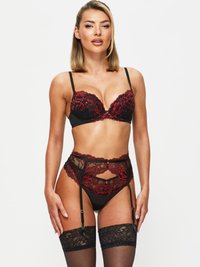 Black lingerie set featuring red floral lace accents. Includes a padded bra, high-waisted garter belt, and thigh-high stockings with lace tops.