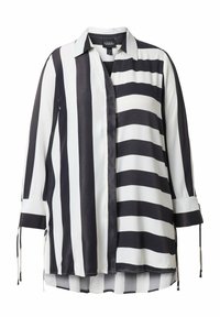 Černobílá proužkovaná halenka s límečkem, dlouhými rukávy a zavazovacími manžetami. Hladká, lehká látka s volným střihem.