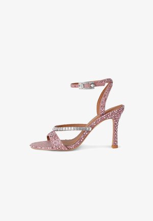 Sandalo rosa con tacco alto, cinturino alla caviglia, punta aperta e decorazioni di strass lungo i cinturini e il tacco.
