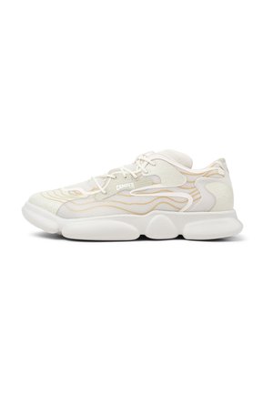 White sneakers with textured overlays and gold accents, featuring a chunky sole, lace-up front, and a logo on the side.