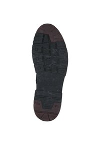 Suola di scarpa in gomma nera con un design del battistrada a motivi; presenta un accento marrone sul tallone e il testo inciso "DENIM TOM TAILOR."