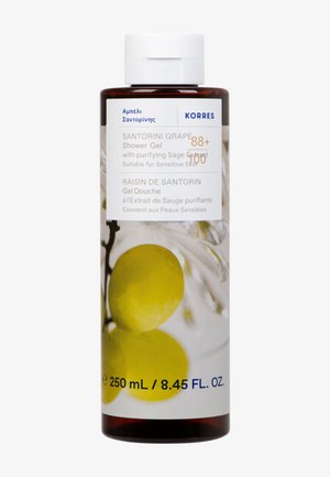 Korres Santorini Traube Duschgel in einer transparenten bernsteinfarbenen Flasche mit einem weißen Deckel, versehen mit einem lebhaften gelben Traubenmotiv. 250 ml.