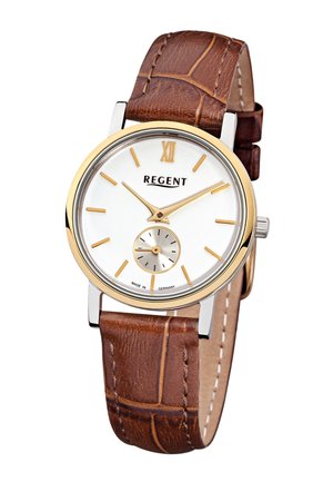 Montre analogique classique avec cadran blanc, index et aiguilles dorés, petit cadran des secondes, et bracelet en cuir marron texturé.