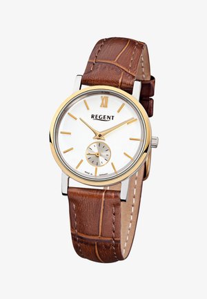 Montre analogique classique avec cadran blanc, index et aiguilles dorés, petit cadran des secondes, et bracelet en cuir marron texturé.