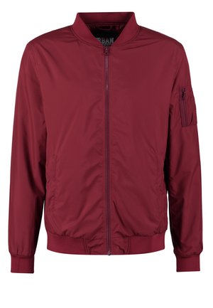 Bordeauxfarbene Bomberjacke aus glattem, leichtem Stoff. Sie verfügt über einen Frontreißverschluss, gerippte Manschetten und eine mit Reißverschluss verschlossene Tasche am linken Ärmel.