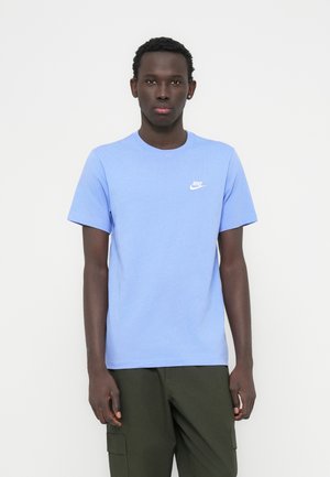 Light blue cotton t-shirt with a round neckline and short sleeves. Features a small white Nike logo on the chest.