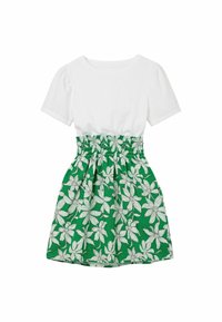 Vitt kortärmat linne med en grön blommönstrad kjol. Kjolen har en rynkad midjeresårlinning och pryds av vita blommor med konturer mot en enfärgad grön bakgrund.