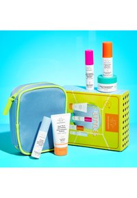 Skincare set with a blue zip pouch featuring neon green accents. Includes five multi-colored bottles and a white tube, all labeled.