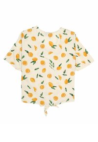 T-shirt à manches courtes en tissu crème clair, présentant un motif de citrus jaune et vert. Fermeture à nouer dans le dos, encolure arrondie et coupe décontractée.
