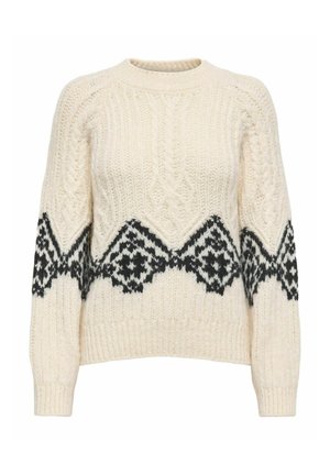 Jersey de punto color crema con un patrón geométrico negro a lo largo de la parte inferior y las mangas. Cuello redondo y puños y dobladillo acanalados.