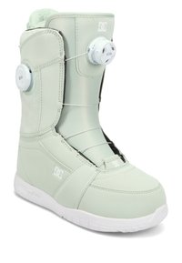 Miętowo-zielony but snowboardowy z syntetycznego materiału, wyposażony w podwójny system sznurowania BOA, wyściełany kołnierz i biały gumowy spód. Akcenty o teksturowanym wzorze.