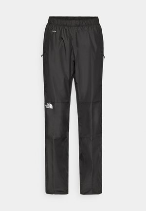 Black waterproof pants made from lightweight fabric, featuring an elastic waistband, side pockets, and a logo on the left leg.