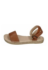 Brown leather sandal featuring a flat sole, two wide straps, and an adjustable ankle strap, with a natural jute-wrapped edge.