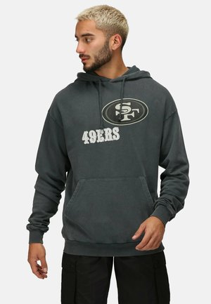 Dark gray hoodie with a front kangaroo pocket, featuring a circular logo and the text "49ERS" in white. Made from a soft material.