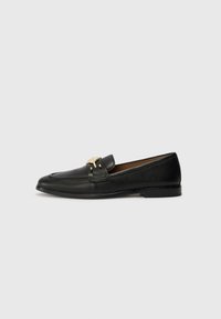 Black leather loafers featuring a gold accent buckle, rounded toe, stitched detailing, and a flat sole for easy wear.