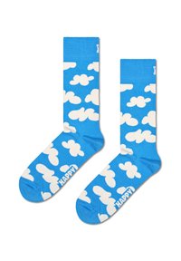 Chaussettes bleues avec des motifs de nuages blancs, bord côtelé et texte "HAPPY" sur la semelle. Fabriquées en matériau doux et extensible.