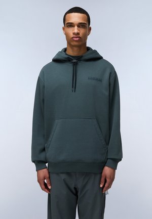 Dunkelgrüne Kapuzenjacke aus weichem Stoff. Sie verfügt über eine Kängurutasche, eine verstellbare Kapuze mit Kordelzug und ein dezentes Logo auf der Brust.