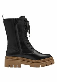 Černá kožená kotníková bota s textured hnědou podrážkou, bočním zipem a předními tkaničkami. Má kulatou špičku a robustní, silnou patu.