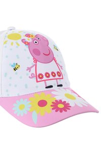 Cappellino bianco con grafica di Peppa Pig, fiori rosa, api e pois colorati. La visiera è rosa con disegni floreali più grandi.