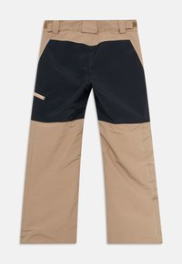 Tvåtone beige och svarta arbetsbyxor med förstärkta knäpartier och en blixtlåsficka på höger lår, utlagda på vit bakgrund.