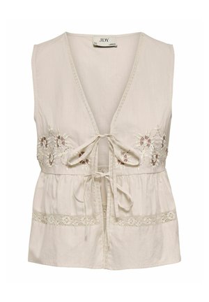 Ärmellose beige Bluse mit tiefem V-Ausschnitt, vorne mit Bindebändern, floraler Stickerei auf der Brust und Spitzenbesatz am Saum.