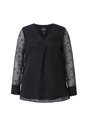 Sort langærmet bluse med V-udskæring, der har gennemsigtige ærmer med polkaprikker og en ensfarvet krop. Glat tekstur med lagdetaljer.