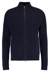 Marinblå stickad tröja med hög krage, hel dragkedja framtill, ribbad nederkant och cuffs, med ett texturerat kabelmönster över hela.