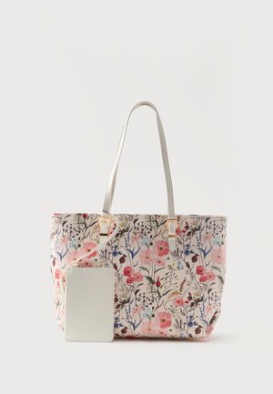 Sac fourre-tout floral avec des fleurs roses, rouges et bleues, des anses crème, et une pochette amovible assortie crème avec fermeture éclair.