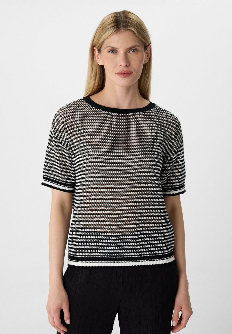 Zwart-wit gestreept gebreid sweater met een ronde halslijn, korte mouwen en een lichtgewicht, gestructureerde stof. Accentueert met een effen zwarte rand.