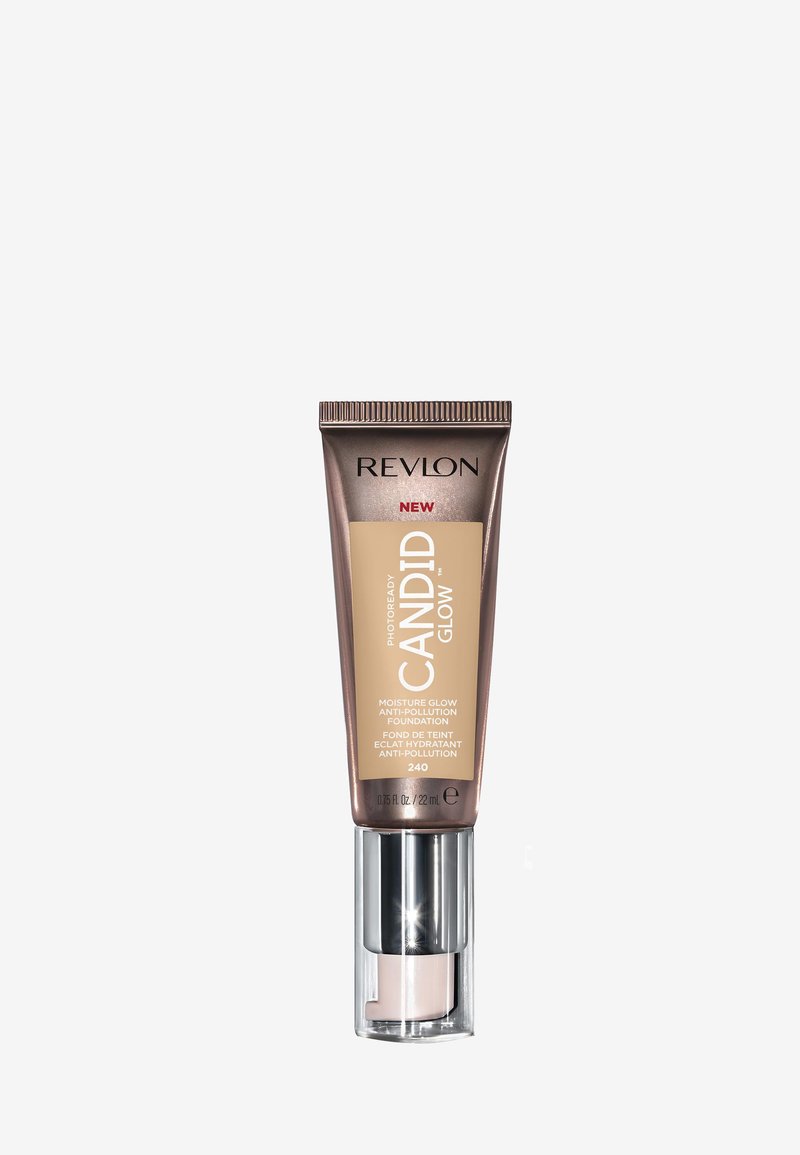 Revlon Grundierung in einer 22 ml Tube mit einem braunen Metallicdesign. Verfügt über eine klare Basis, beschriftet mit "CANDID GLOW", und einem Pumpenspender.