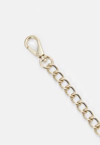 Gold-toned metal chain with large links and a clasp at one end. The chain is shiny with a smooth texture and minimal detailing.