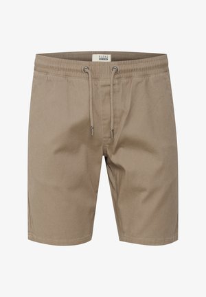 Pantaloncini casual beige con vita elasticizzata e coulisse, occhielli metallici e dettagli di cuciture frontali.