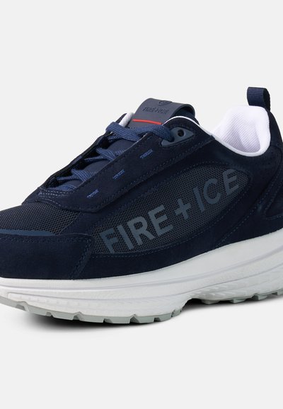 Navy blue sneaker with white sole, mesh and suede panels, navy laces, and "FIRE + ICE" branding on the side.