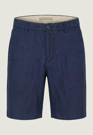 Marineblauwe knielange korte broek met knoop- en ritssluiting, riemlussen en zijzakken, afgebeeld tegen een lichte achtergrond.