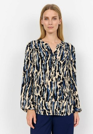 Long-sleeve blouse in a beige fabric featuring a blue and black abstract pattern. V-neck design with button detail at the collar.