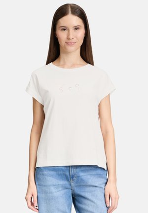 T-shirt en coton blanc à manches courtes retroussées, avec des accents de strass colorés au design ludique sur le devant. Coupe simple et décontractée.