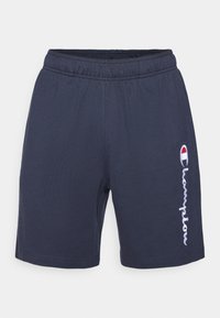 Mørkeblå bomullsshorts med elastisk midje. Har hvit brodert "Champion"-logo på venstre side. Glatt tekstur.