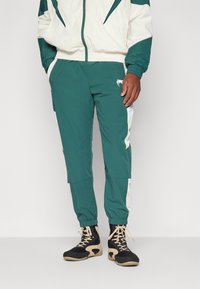 Venum ATTACK 90 JOGGERS - Trainingsbroek - forest green/ice