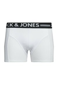 White boxer shorts with a black elastic waistband featuring "JACK & JONES" in white text; smooth fabric, mid-thigh length, fitted design.