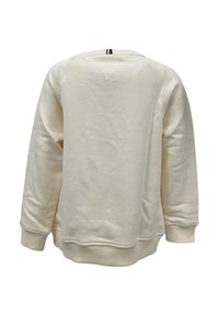 Felpa beige chiaro con collo rotondo, polsini e orlo a costine. Texture morbida con un design semplice e minimalista. Senza loghi o motivi visibili.