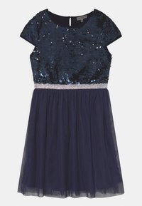 Marineblaues Kleid mit einem Paillettenoberteil, kurzen Ärmeln, Tüllrock und einem schimmernden silbernen Taillenbund. Schlüssellochverschluss im Rücken.