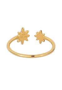 Open cuff ring in goudkleurig metaal, met aan elk uiteinde twee zonnestraalaccenten. Vloeroppervlak met duidelijke merktekens.