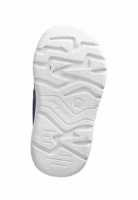 Semelle de chaussure en caoutchouc blanc pour enfant avec un motif de bande de zigzag et un numéro de taille 20 estampillé près du centre.