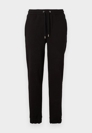 Juodos sporto kelnės, pagamintos iš minkštos medžiagos, su elastinga juosta ir raišteliais, šoninėmis kišenėmis ir surinktomis rankovėmis ties kulkšnimis.