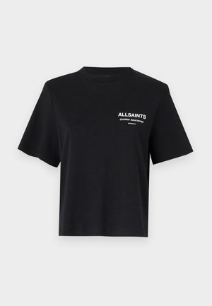 Black cotton T-shirt with a crew neckline and short sleeves. Features white printed text on the left chest area. Simple, relaxed fit.