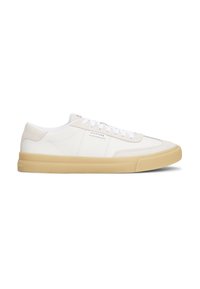 White leather sneakers with suede accents, lace-up design, and a textured beige rubber sole. Features a logo on the side.