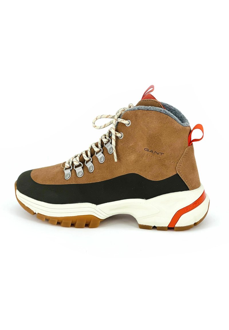 Braune und schwarze Wildleder-Hochschnitt-Wanderschuhe mit grauem Futter, weißer Zwischensohle, Gummiaußensohle und rotem Fersenelement. Enthält Metall-Ösen und Schnürsenkel.